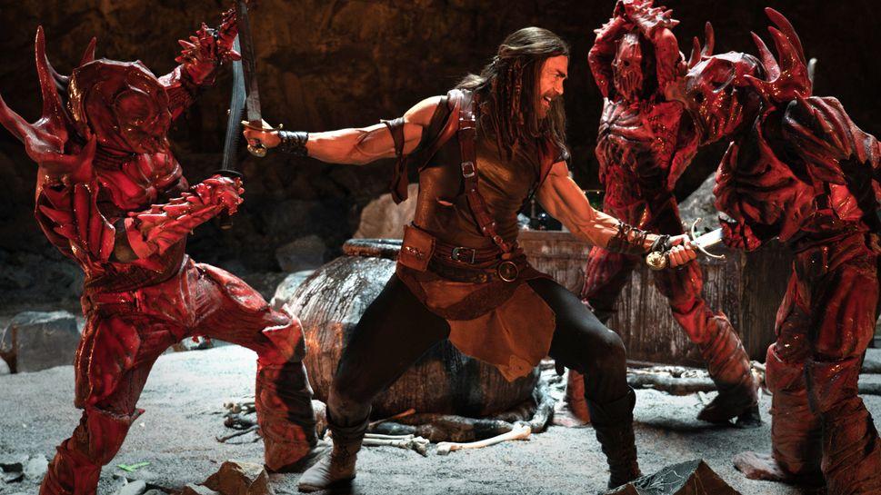still from Deathstalker - Deathstalker is killing a bunch of blood demon guys (dreadites?)